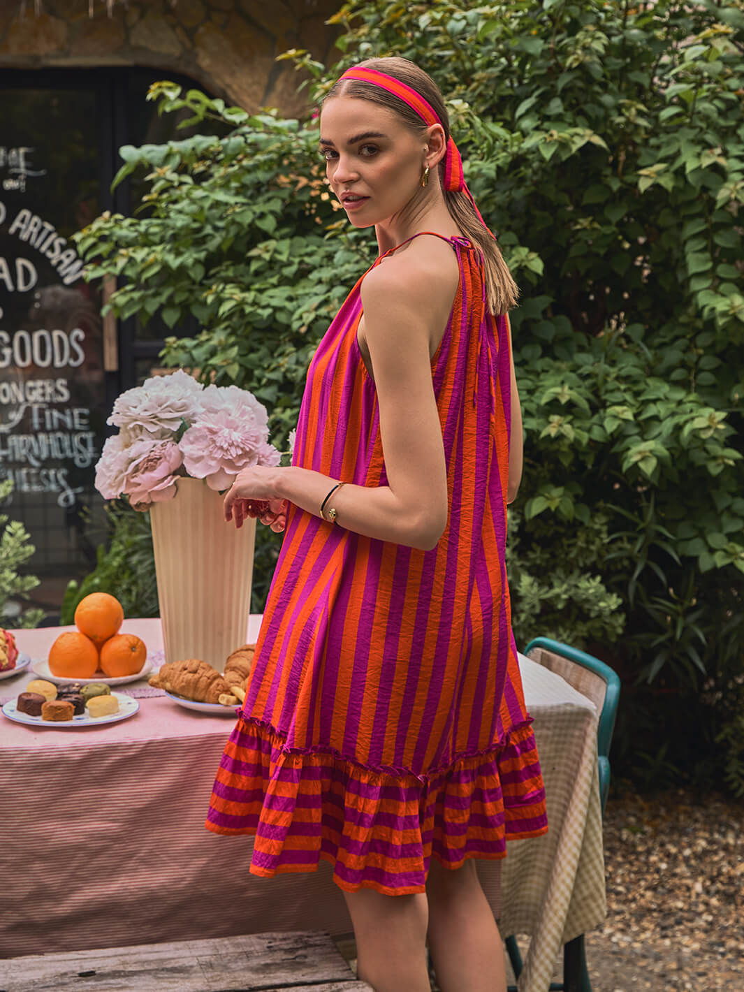 holiday dress | festive wear | red dress | pink dress | short dress | trendy dress | trendy fashion | resort wear | birthday party dress | latest fashion | girls fashion | one-piece dress | bra less dress | stripe dress | halter pink dress | halter dress | outdoor fashion